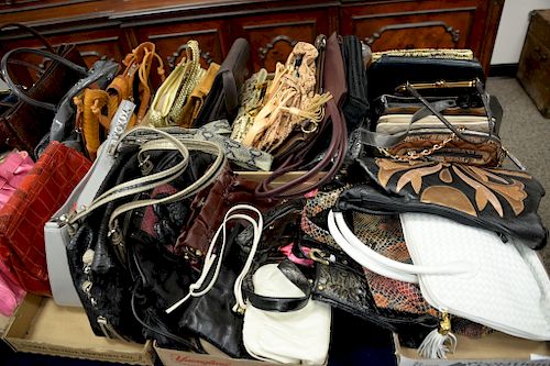 Table lot of mostly leather purses and wallets to include Sharif Studio, La Reagle, Palizzio, Maxx New York, Bellini, etc.