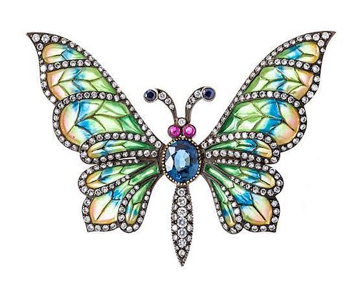 A Silver Topped Gold, Plique-A-Jour Enamel, Diamond, Ruby and Sapphire Butterfly Brooch, 17.00 dwts.