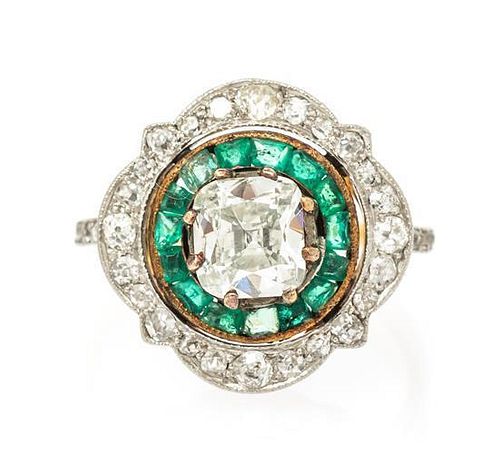 An Edwardian Platinum Topped Gold, Diamond and Emerald Ring, 3.00 dwts.