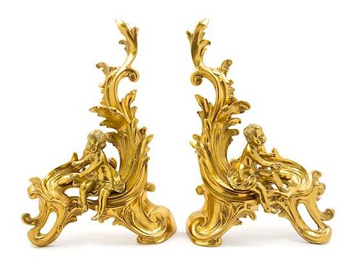 A Pair of Louis XV Style Gilt Bronze Chenets Height 19 1/2 x width 23 inches.