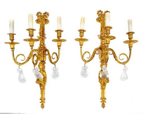 A Pair of Louis XV Style Bronze and Rock Crystal Three-Light Figural Sconces Height 27 1/2 inches.