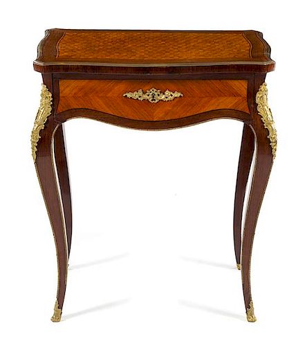 A Louis XV Style Gilt Bronze Mounted Kingwood and Parquetry Sewing Table Height 28 1/2 x width 24 1/2 x depth 17 inches.