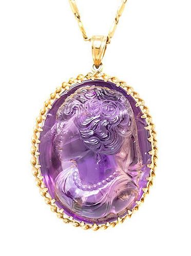 A 14 Karat Yellow Gold and Amethyst Cameo Pendant, 35.50 dwts.
