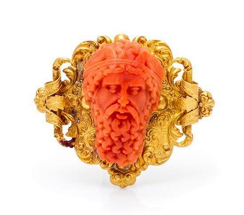 A Victorian Yellow Gold and Carved Coral Cameo Brooch, 6.80 dwts.
