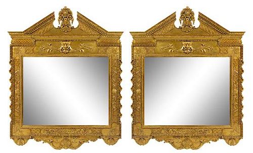 A Pair of Georgian Style Carved Giltwood Mirrors Height 66 x width 52 inches.