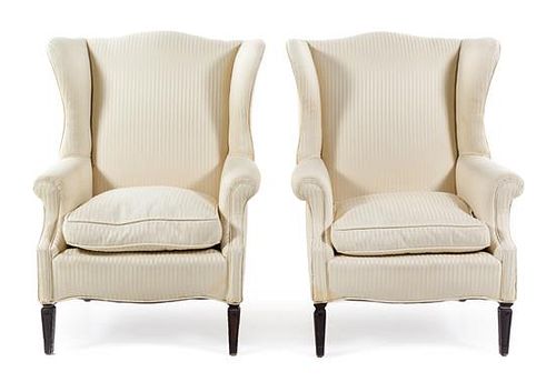 A Pair of Georgian Style Wingback Armchairs Height 39 inches.