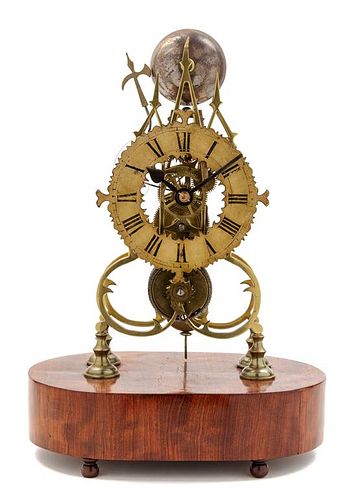 An English Brass Skeleton Clock Height 16 1/4 inches.