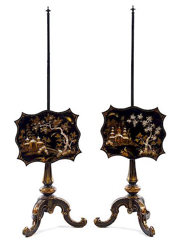 A Pair of Ebonized and Mother-of-Pearl Inlaid Pole Screens Height 53 1/4 inches.