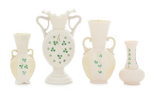 * Four Belleek Shamrock Decorated Vases Height of tallest 9 inches.