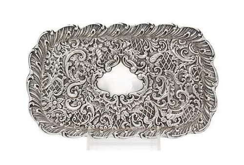 A Victorian Silver Tray, H. Matthews, Birmingham, 1898, of rectangular form with allover rococo decoration, centered by a vacant