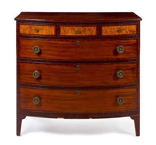 An American Mahogany and Tiger Maple Chest of Drawers Height 39 1/4 x width 41 3/4 x depth 21 7/8 inches.