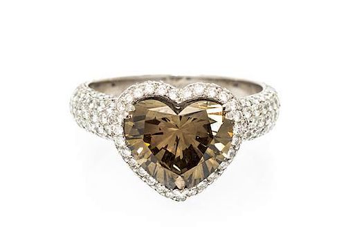 An 18 Karat White Gold, Colored Diamond and Diamond Ring, 3.90 dwts.