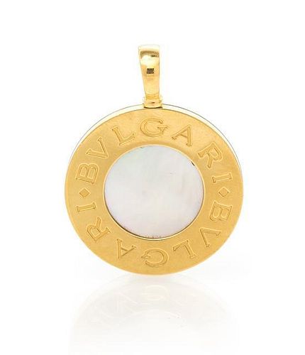 A Reversible 18 Karat Yellow Gold, Steel, Mother-of-Pearl and Onyx Pendant, Bulgari, 11.55 dwts.