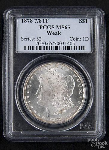 Silver Morgan dollar coin, 1878 7/8 TF, PCGS MS-65, weak.