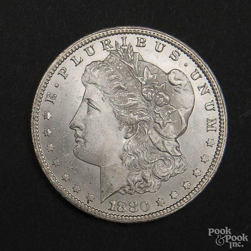 Silver Morgan dollar coin, 1880 CC, MS-63 to MS-64.