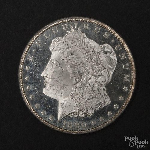 Silver Morgan dollar coin, 1880 S DMPL, MS-63 to MS-64.