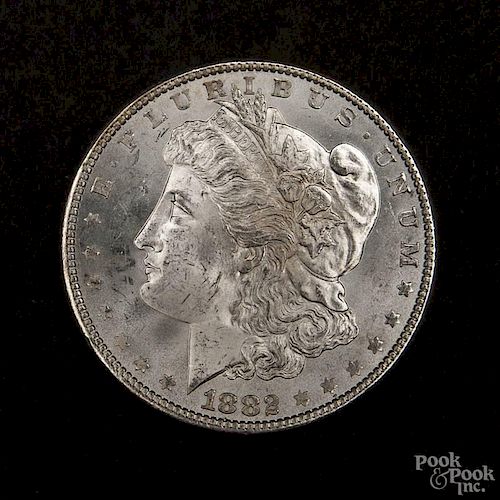 Silver Morgan dollar coin, 1882, MS-63 to MS-64.