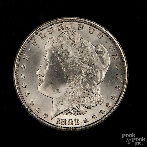Silver Morgan dollar coin, 1883 CC, MS-64 to MS-65.