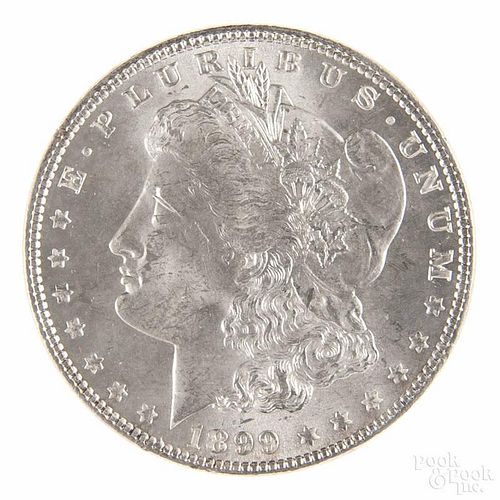 Silver Morgan dollar coin, 1899, MS-63 to MS-64.