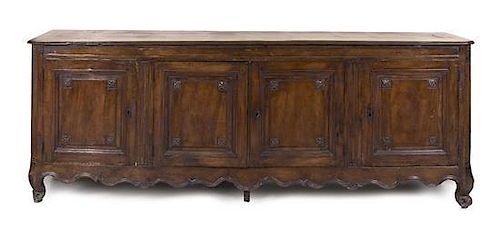 A Louis XV Provincial Walnut Side Cabinet, Height 41 x width 109 1/2 x depth 25 inches.
