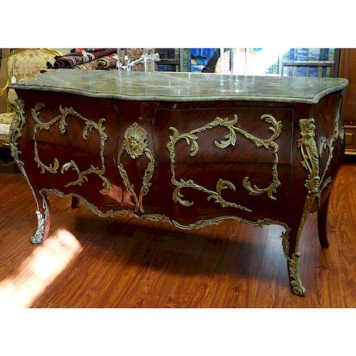 Large Louis XV Style Gilt Bronze Mounted Marble Top Commode. Includes four drawers with foliage for