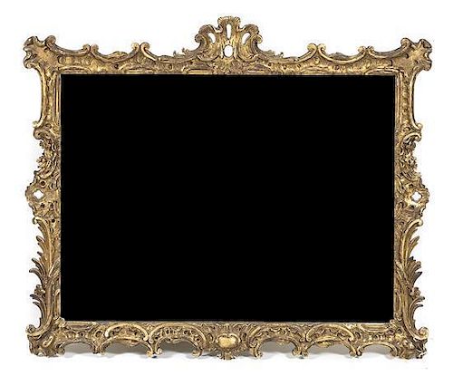An Italian Baroque Giltwood Mirror, 50 1/4 x 59 1/4 inches.