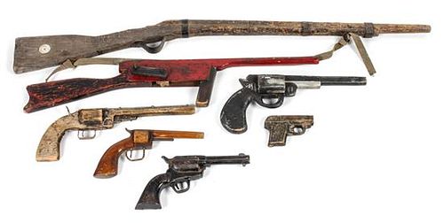 Seven Decorative and Toy Guns Length of largest 40 1/2 inches