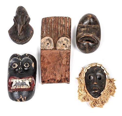 Five Decorative Carved Wood Masks Height of largest 10 inches