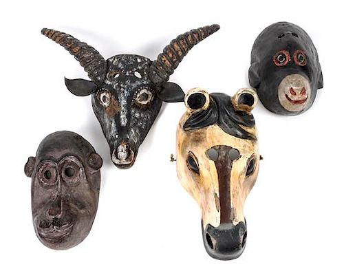 Four Carved Wood Polychrome Animal Masks Length of largest 13 inches