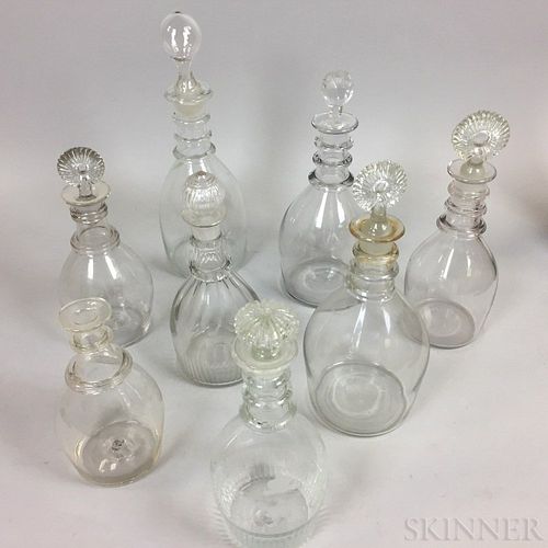 Eight Blown Colorless Glass Decanters