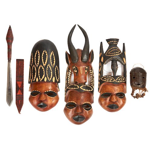 Three African Wood Masks, a Shell Mask and Taureg Sword and Scabbard
