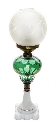 An American Victorian Glass and Brass Mounted Oil Lamp. Height 21 inches.