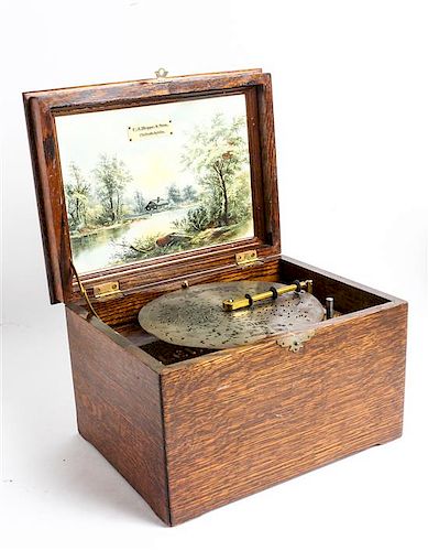 An American Cased Music Box Height 8 x width 12 1/4 inches.