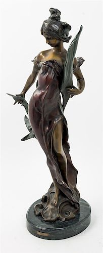 An Art Nouveau Style Bronze Figure, R. Roche Height 25 1/2 inches.