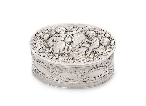 A German Silver Box, 19th/20th Century, of oval form, worked to show figures in relief.