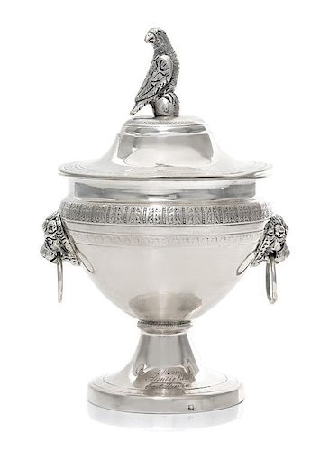 A Continental Silver Covered Sugar, 19th Century, the lid with a bird form finial, the body with mask ring handles.