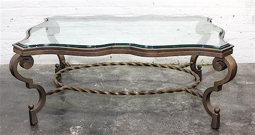* A Wrought Iron and Glass Low Table Height 19 5/8 x width 50 1/2 x depth 22 3/4 inches.