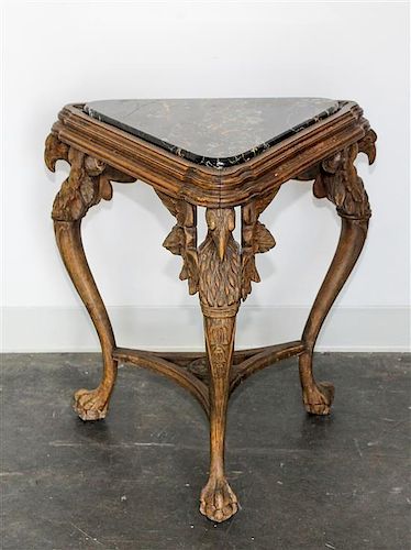 * An Italian Carved Walnut Figural Table Height 24 inches.