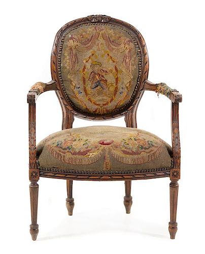A Louis XVI Style Fauteuil Height 35 inches.