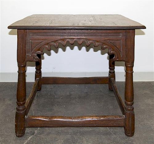 A Gothic Revival Oak Center Table Height 30 1/4 x width 36 x depth 36 inches.