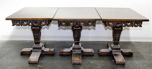 A Renaissance Revival Triple Pedestal Dining Table Height 29 1/2 inches.