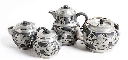 Four Chinese Pewter Mounted Yixing Pottery Tea Pots Height of tallest 6 1/8 inches.