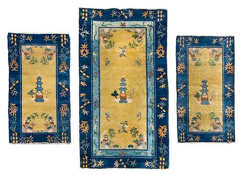 * A Group of Four Chinese Wool Rugs Largest 8 feet 8 inches x 8 feet.