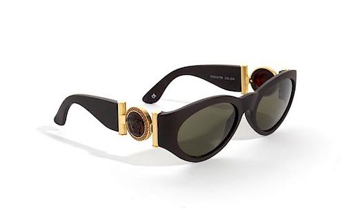 A Pair of Gianni Versace Brown Sunglasses,
