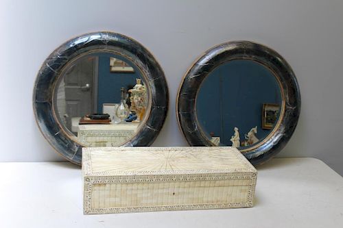 A Pair Of Round Metal Clad Mirrors Together