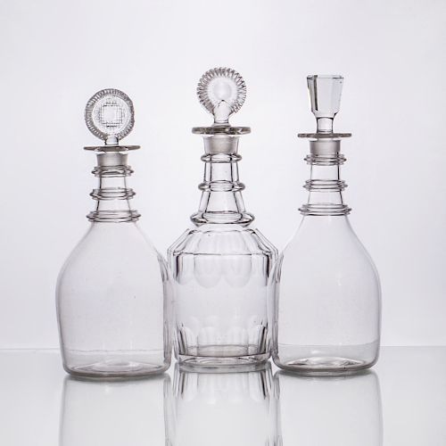 Pair of English Glass Ring-Neck Decanters and Stoppers, and a Single Decanter and a Stopper
