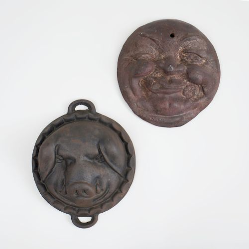 Cast Iron Smiling Moon Face and a Cast Iron Two-Handled Pig Face Mold