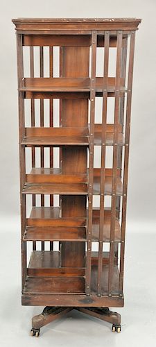 Danner mahogany revolving bookcase. ht. 67in., wd. 24in.