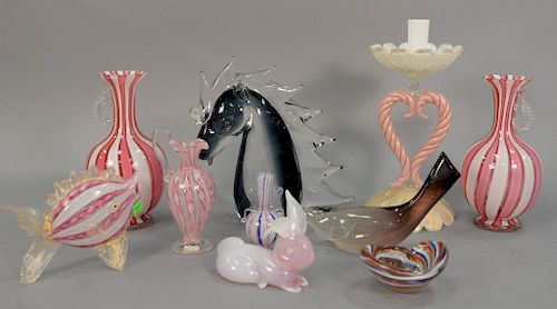 Group of Murano art glass pieces to include pink and white candlestick, pair of pink and white stripe vases with handles, three cand...