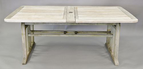 Teak extendable table having two built in leaves. ht. 30in., top closed: 43" x 76"